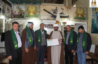 لجنة الإرشاد والتعبئة في العتبة العلوية تكرم حملات الدعم اللوجستي من النجف الأشرف بوشاح أمير المؤمنين(ع)