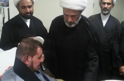 وفد من العتبة العلوية المقدسة يتفقد جرحى الحشد الشعبي